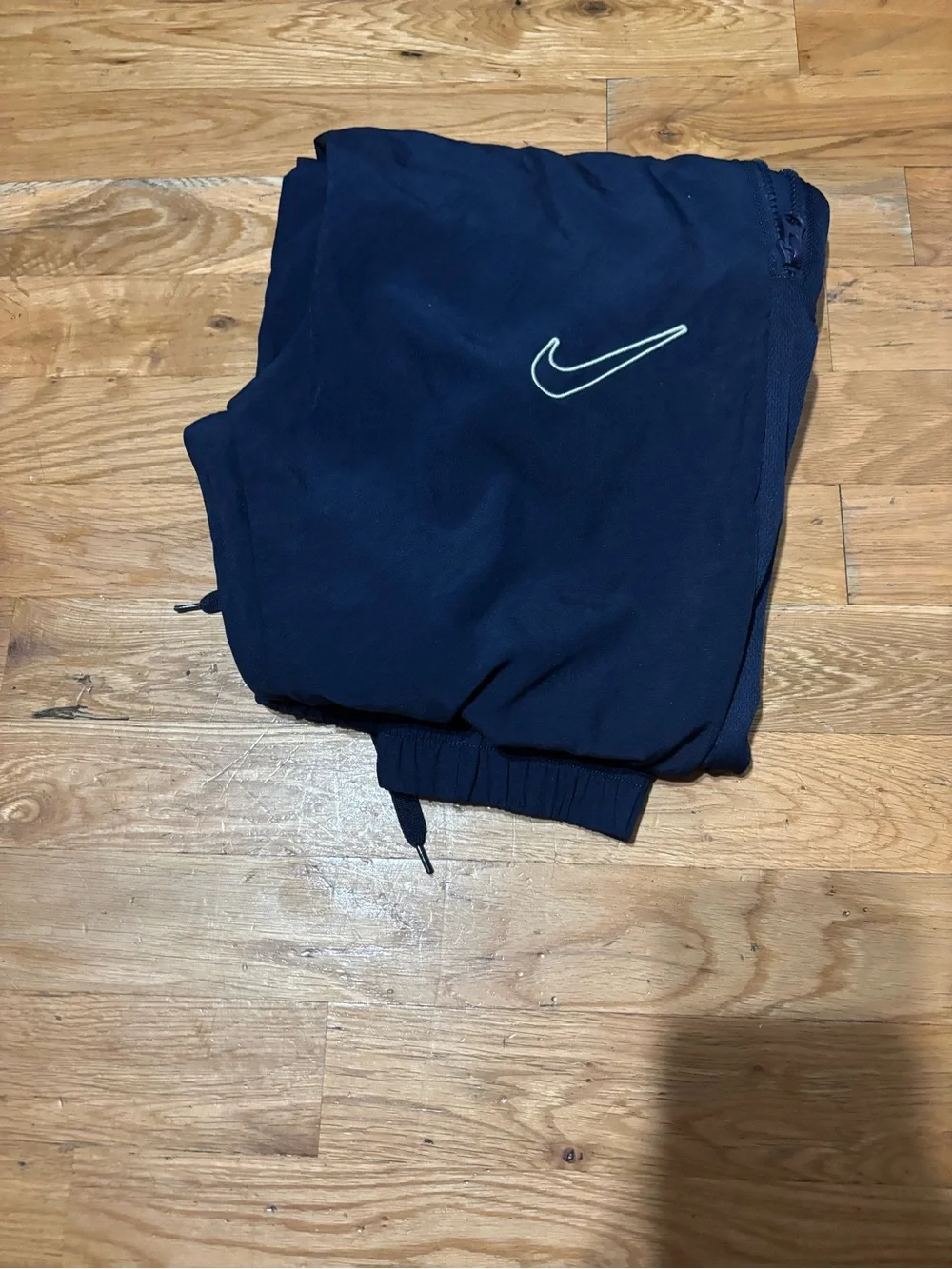 Nike White Tag with Black Swoosh and Text